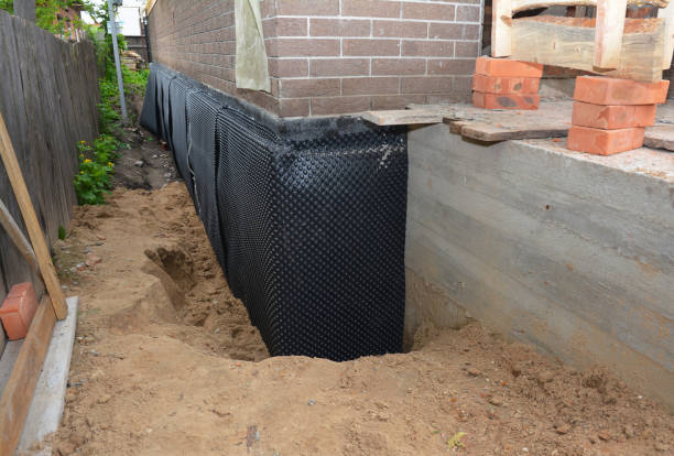 Happy homeowners after waterproofing job in Seven Mile
